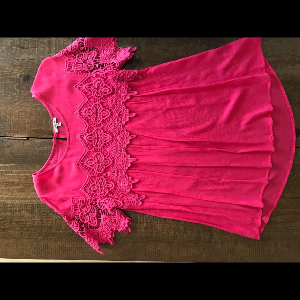 Pink short sleeve top with lace accent on chest. Size small.
